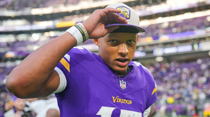 Joshua Dobbs wearing a hat after a Vikings win